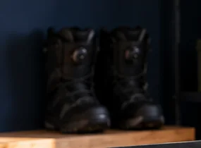 Pair of snowboard boots on a workshop shelf, ready for a snowboard boot fit check
