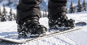 Snowboard boots in bindings showing boot size against board width