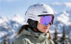 Snowboard helmet being checked for fit before a day on the slopes